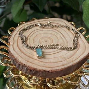 Elegant Gold Bracelet with Blue Gemstone